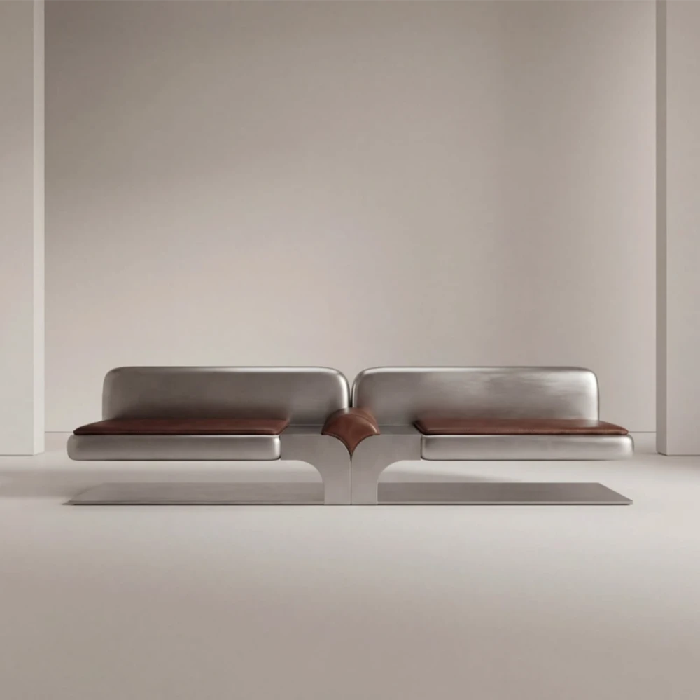 Full front view of the Confluence bench by Diamant Versatile, combining brushed metal construction with brown leather upholstery.