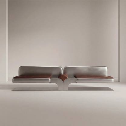 Full front view of the Confluence bench by Diamant Versatile, combining brushed metal construction with brown leather upholstery.