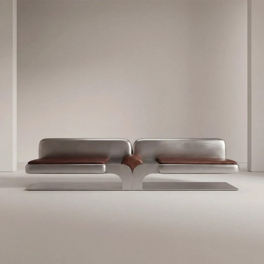 Full front view of the Confluence bench by Diamant Versatile, combining brushed metal construction with brown leather upholstery.
