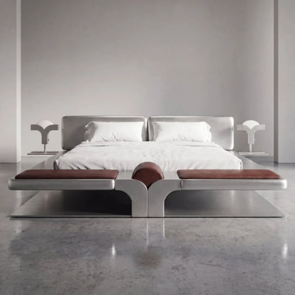 Front view of the Confluence bed by Diamant Versatile, featuring integrated side tables, white lamps and brown leather foot cushions.