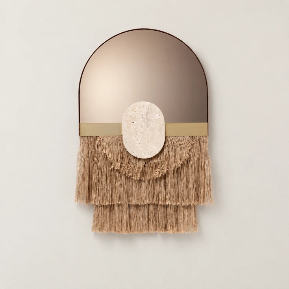 Souk Ecru Mirror by Dooq Details, featuring an arched bronze-toned mirror, gold-toned band, oval stone ornament and three layered tiers of tan fringe.