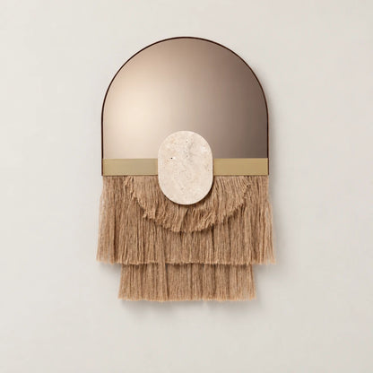 Souk Ecru Mirror by Dooq Details, featuring an arched bronze-toned mirror, gold-toned band, oval stone ornament and three layered tiers of tan fringe.