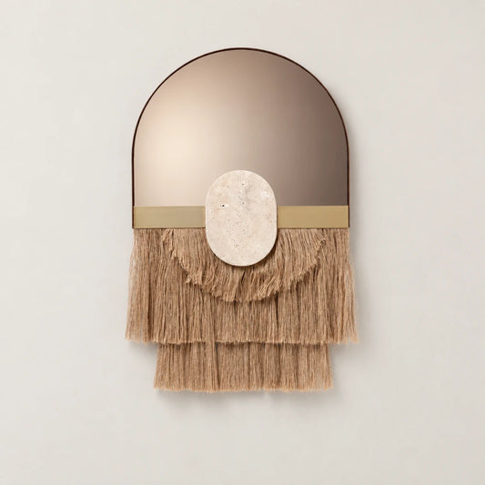 Souk Ecru Mirror by Dooq Details, featuring an arched bronze-toned mirror, gold-toned band, oval stone ornament and three layered tiers of tan fringe.