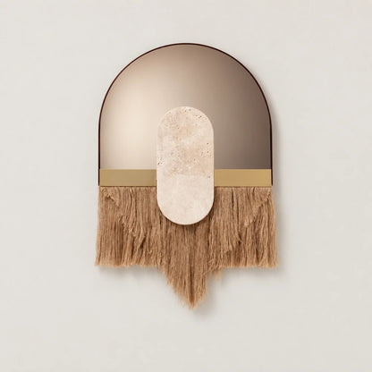 Souk Ecru Mirror by Dooq Details, with an arched bronze-toned surface, elongated pale stone ornament and tan fringe tapering to a central point.