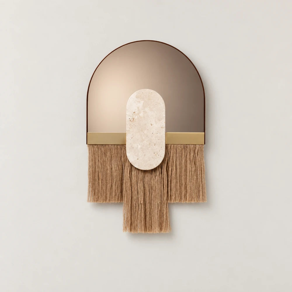 Souk Ecru Mirror by Dooq Details, featuring an arched mirror, pale capsule-shaped stone ornament and straight tan fringe with a longer rectangular centre panel.