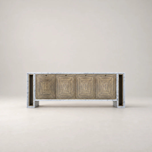 Front view of the BB04 Sideboard by Eva Szumilas, showing concentric rectangular patterns on four brass doors framed by white veined marble.