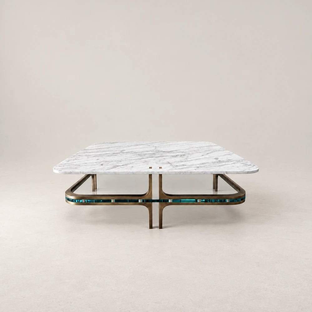 Front view of the CT01 Coffee Table by Eva Szumilas, with a white marble top, curved gold-toned frame and turquoise band around the base.