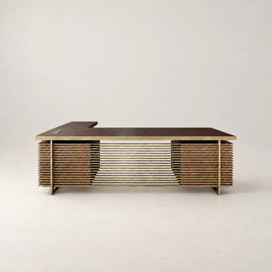 Front view of the DK02 Desk by Eva Szumilas, with a dark L-shaped desktop, gold-toned frame and horizontal bars spanning two wooden pedestals.