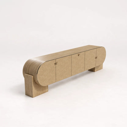 Angled view of the C01 Sideboard from the X Collection by Eva Szumilas in natural oak, showing rounded ends, geometric handles and broad wooden supports.