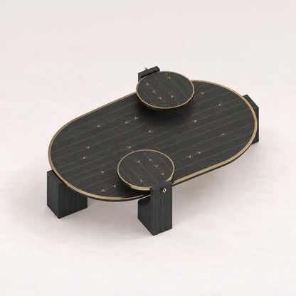 CT02 Coffee Table from the X Collection by Eva Szumilas in black wood, with an elongated rounded top, two raised circular platforms and gold-toned arrow inlays.