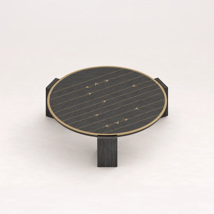 CT01 Coffee Table from the X Collection by Eva Szumilas in black wood, with a round top, gold-toned rim, linear inlays and three block legs.
