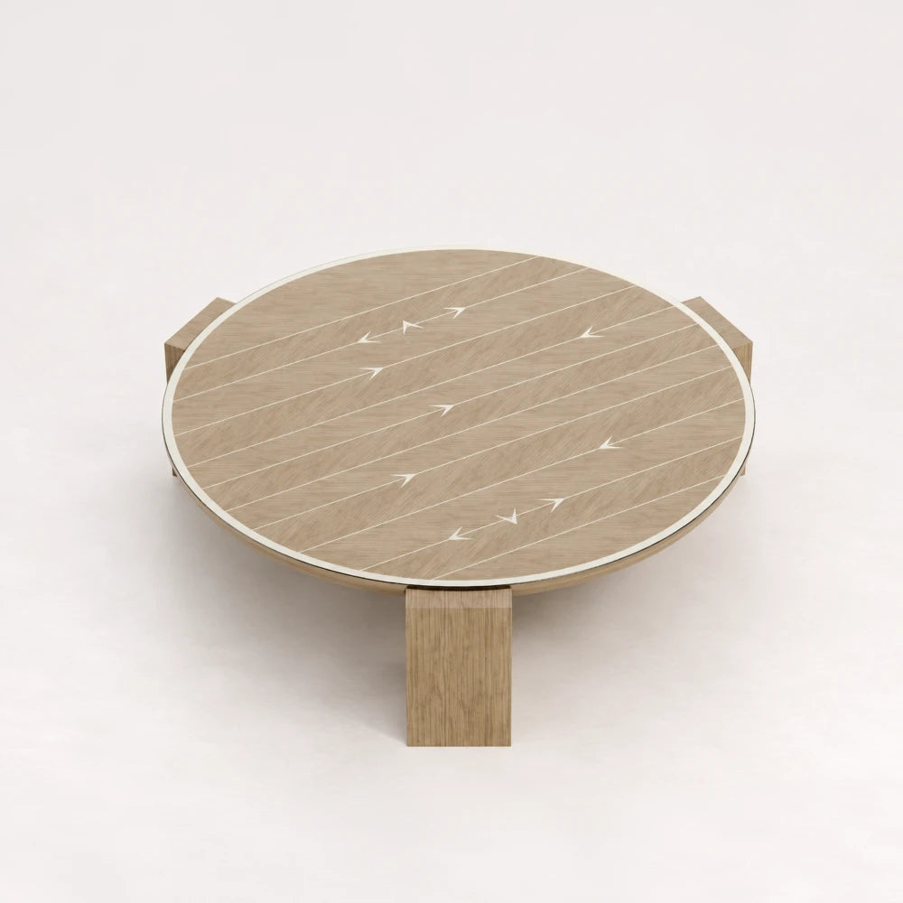 CT01 Coffee Table from the X Collection by Eva Szumilas in natural oak, with a circular top, pale linear inlays, arrow motifs and three wooden legs.