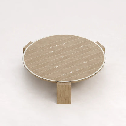 CT01 Coffee Table from the X Collection by Eva Szumilas in natural oak, with a circular top, pale linear inlays, arrow motifs and three wooden legs.
