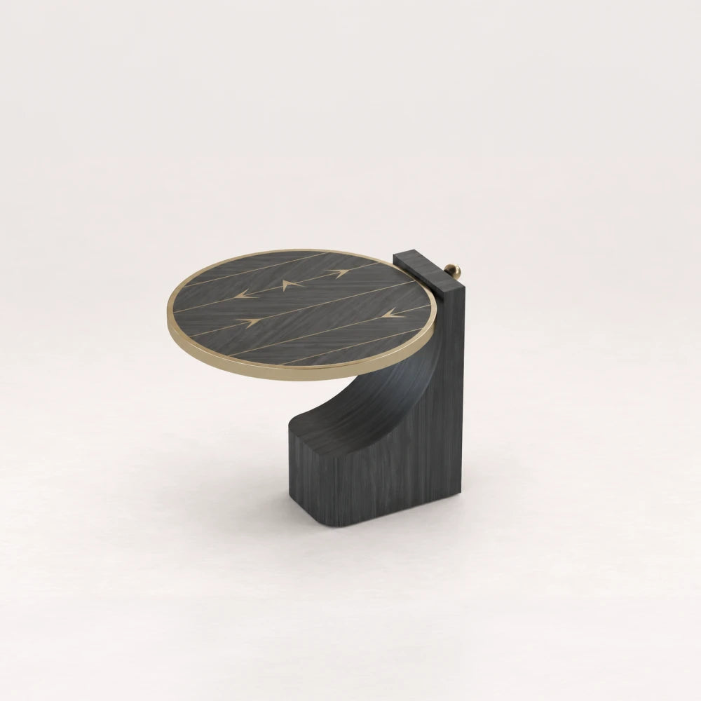 ST01 Side Table from the X Collection by Eva Szumilas in black wood, featuring a circular top, gold-toned arrow inlays and a curved sculptural base.