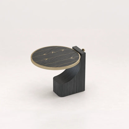 ST01 Side Table from the X Collection by Eva Szumilas in black wood, featuring a circular top, gold-toned arrow inlays and a curved sculptural base.