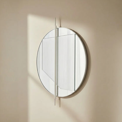 Small Claude Mirror by Garnier Pingree in sunlight, with ribbed glass and projecting vertical rods casting shadows on a beige wall.