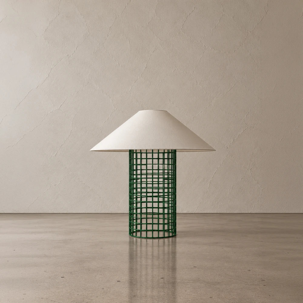 Green Ento Table Lamp by Garnier Pingree, featuring a cylindrical metal grid base beneath a broad cream conical shade.