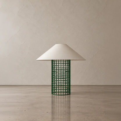 Green Ento Table Lamp by Garnier Pingree, featuring a cylindrical metal grid base beneath a broad cream conical shade.