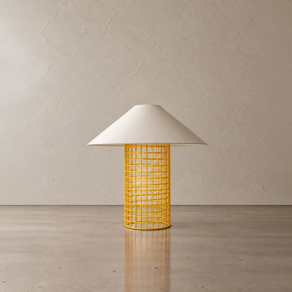 Yellow Ento Table Lamp by Garnier Pingree, with a bright cylindrical metal grid base supporting a wide cream conical shade.