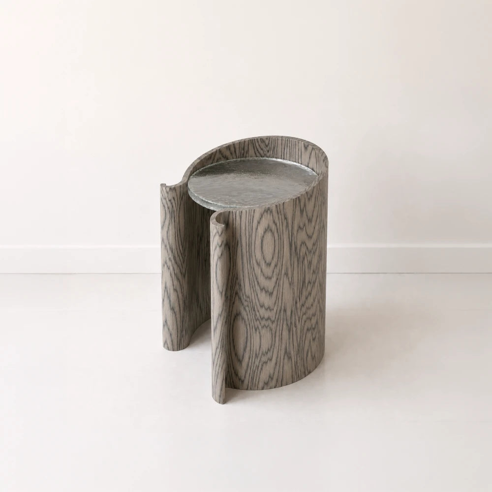 Volute Side Table by Garnier Pingree in the Sottsass finish, with dark wavy wood grain, curled front edges and a grey stone top.