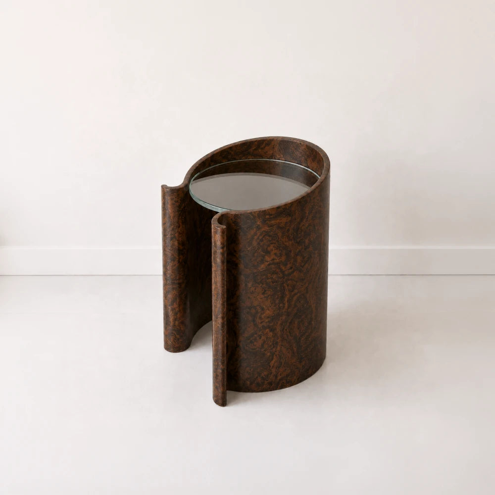 Volute Side Table by Garnier Pingree in California Burl, with swirling dark wood grain, curled edges and a circular glass top.