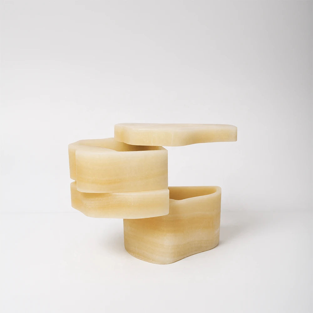 White Moth Nightstand by Panorammma opened to reveal its rotating white onyx compartments