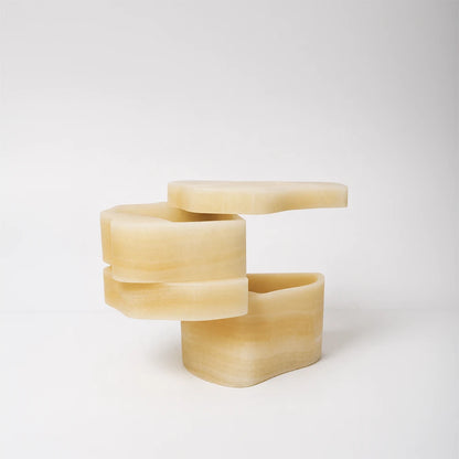 White Moth Nightstand by Panorammma opened to reveal its rotating white onyx compartments
