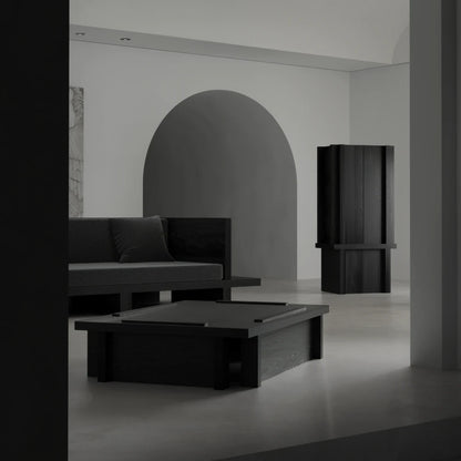 Itooraba Cabinet by Sizar Alexis displayed in a minimalist interior, featuring a tall black pine structure with strong architectural lines.