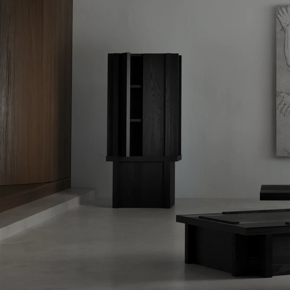 Front view of the Itooraba Cabinet by Sizar Alexis with one door partially open, revealing the dark internal shelving.