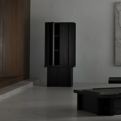 Front view of the Itooraba Cabinet by Sizar Alexis with one door partially open, revealing the dark internal shelving.