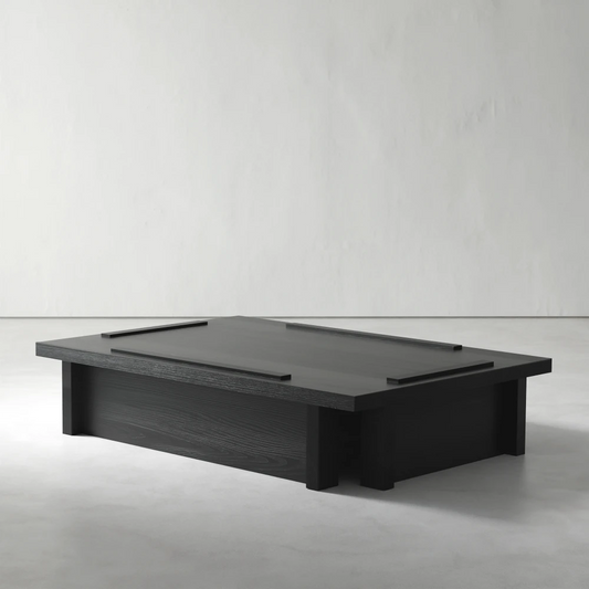 Three-quarter view of the Itooraba Coffee Table by Sizar Alexis, highlighting its low black pine structure and raised linear tabletop details.