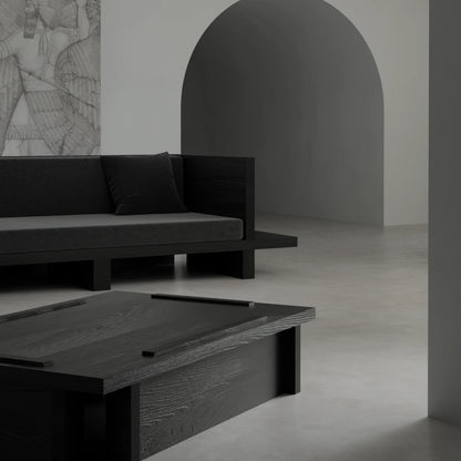 Close-up of the Itooraba Coffee Table by Sizar Alexis, revealing its pronounced black pine grain, layered top and geometric base.