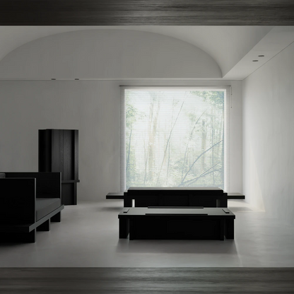Front view of the Itooraba Daybed by Sizar Alexis in a bright architectural interior, surrounded by coordinating black furniture.