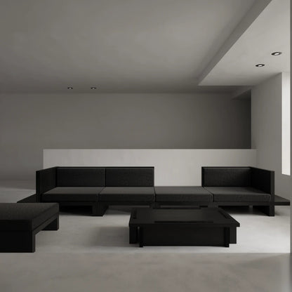 Itooraba Modular Sofa by Sizar Alexis arranged as a large sectional with dark upholstery and geometric black pine platforms.