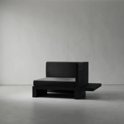 Left Corner module of the Itooraba Modular Sofa by Sizar Alexis, featuring dark cushions, a black pine frame and extended side platform.