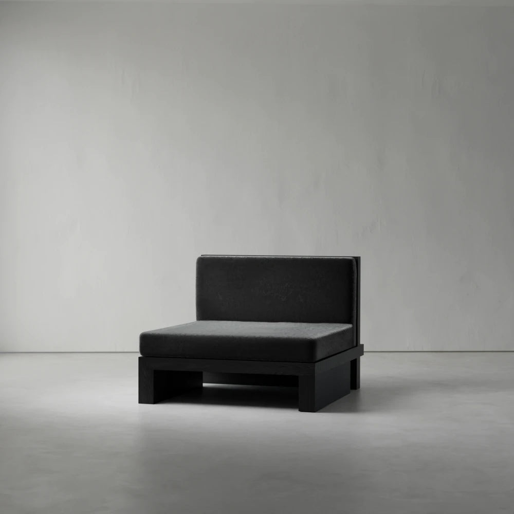 Armless module of the Itooraba Modular Sofa by Sizar Alexis, combining a dark upholstered seat with a low black pine base.