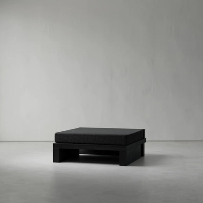 Ottoman module from the Itooraba Modular Sofa by Sizar Alexis, featuring a dark cushion supported by a geometric black pine frame.