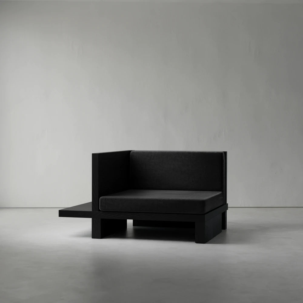 Right Corner seat from the Itooraba Modular Sofa by Sizar Alexis, featuring dark upholstery and an asymmetrical black pine side platform.