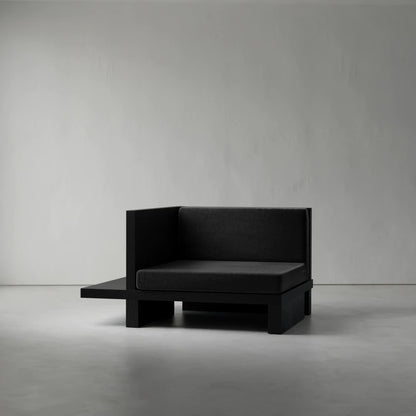 Right Corner seat from the Itooraba Modular Sofa by Sizar Alexis, featuring dark upholstery and an asymmetrical black pine side platform.