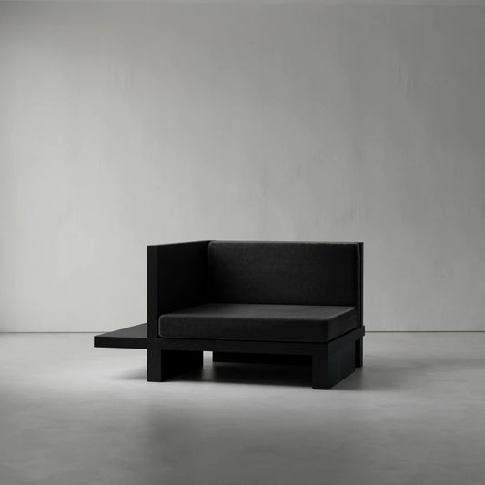 Right Corner seat from the Itooraba Modular Sofa by Sizar Alexis, featuring dark upholstery and an asymmetrical black pine side platform.