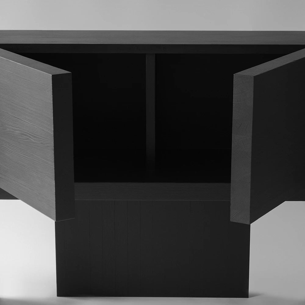 Close-up of the open Itooraba Sideboard Black by Sizar Alexis, showing the dark interior compartment and thick solid pine doors.