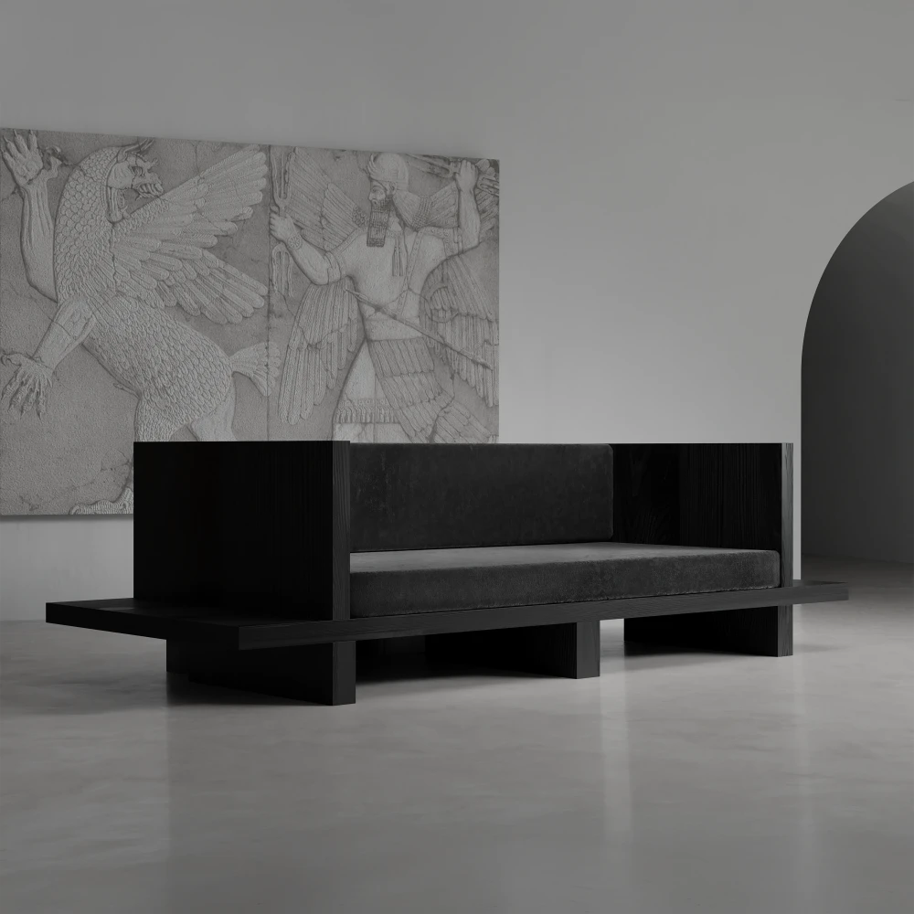 Three-quarter view of the Itooraba Sofa by Sizar Alexis, featuring dark upholstery, a black pine frame and extended side platforms.