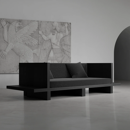 Itooraba Sofa by Sizar Alexis with dark cushions, highlighting its geometric black pine structure and low architectural silhouette.