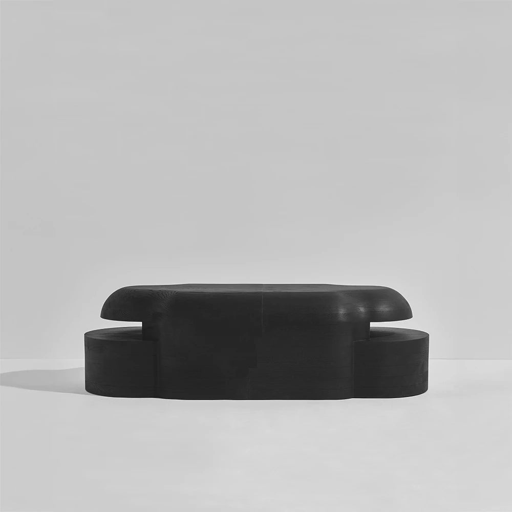 Front view of the Lahmu Large Console Black by Sizar Alexis, featuring rounded solid wood volumes and layered geometric sections.