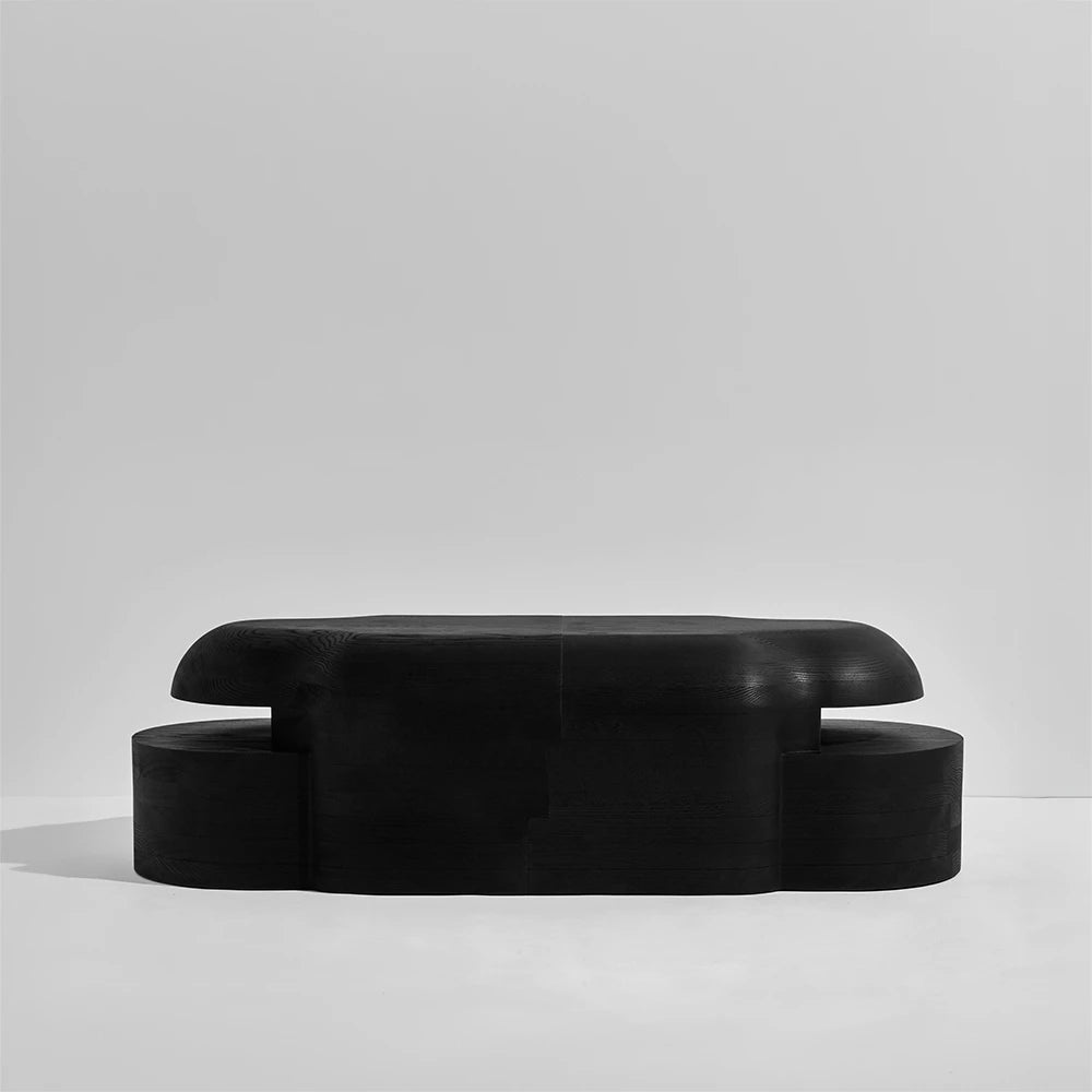 Detailed front view of the Lahmu Large Console Black by Sizar Alexis, highlighting its symmetrical form and smoothly rounded upper volume.