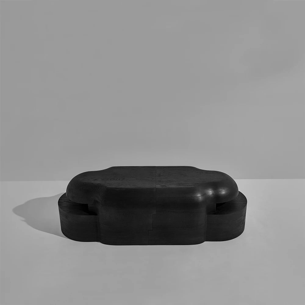 Elevated front view of the assembled Lahmu Large Console Black by Sizar Alexis, emphasizing its joined modules and continuous curved silhouette.