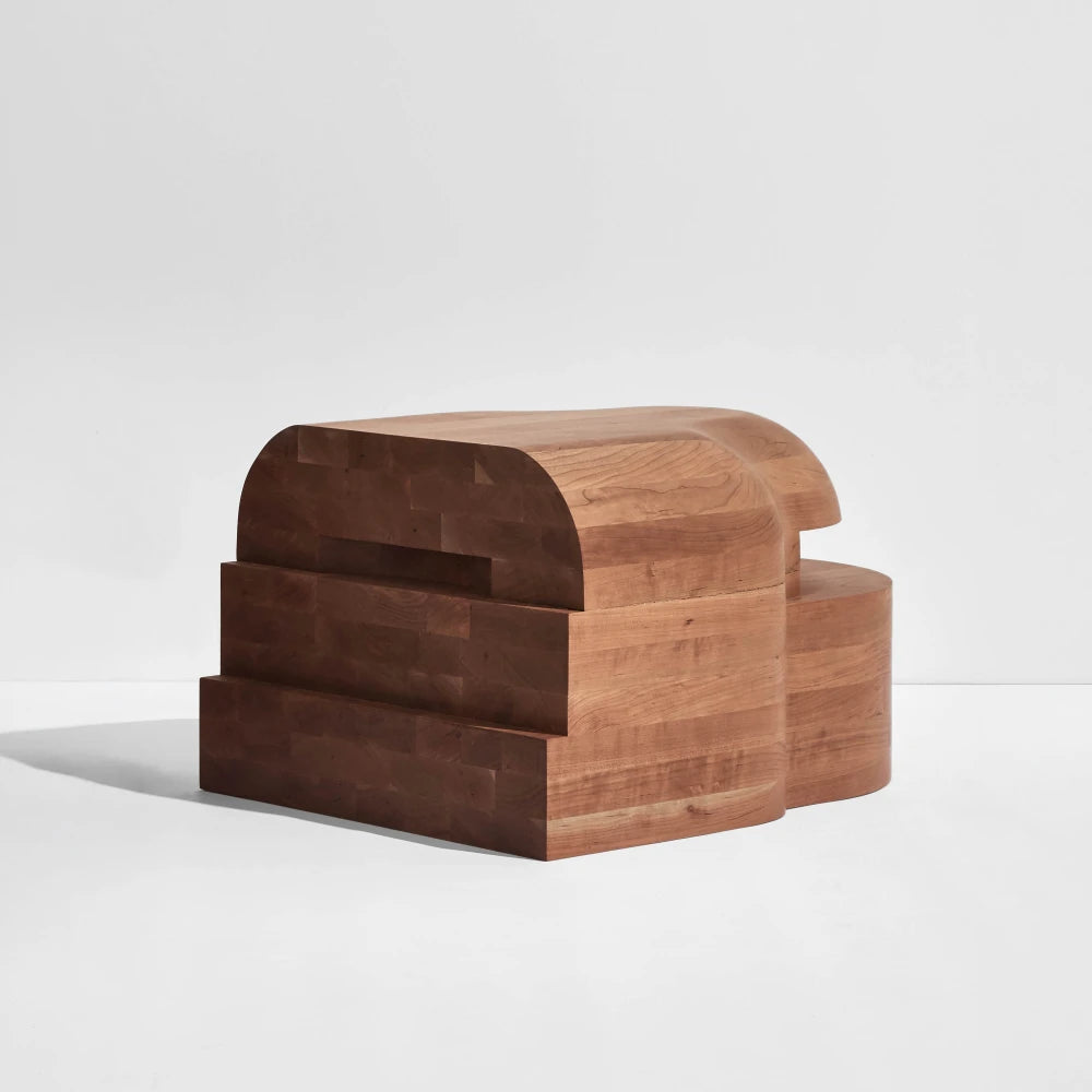Side module of the Lahmu Large Console Natural by Sizar Alexis, showing its rounded top, stepped front and substantial wooden construction.