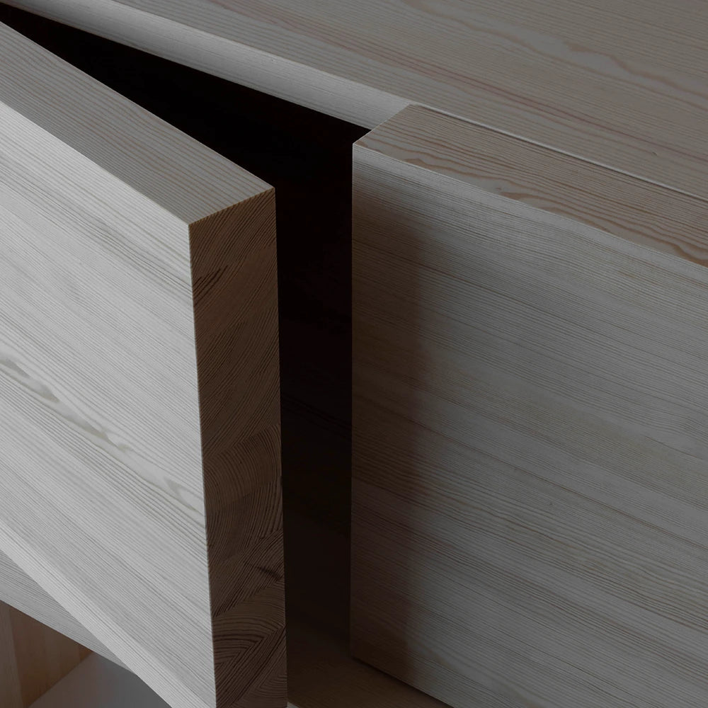 Close-up of the Itooraba Sideboard Natural by Sizar Alexis, revealing the projecting door, dark interior gap and thick pine construction.