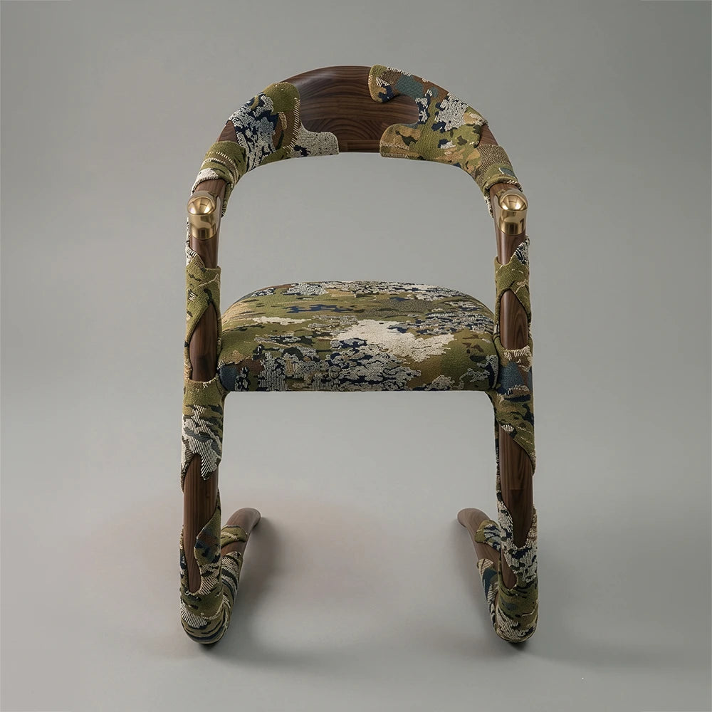 Straight view of the Jardin Dining Armchair by Studio Romell, highlighting its bronze ferrules, walnut frame and Eden Algues upholstery.