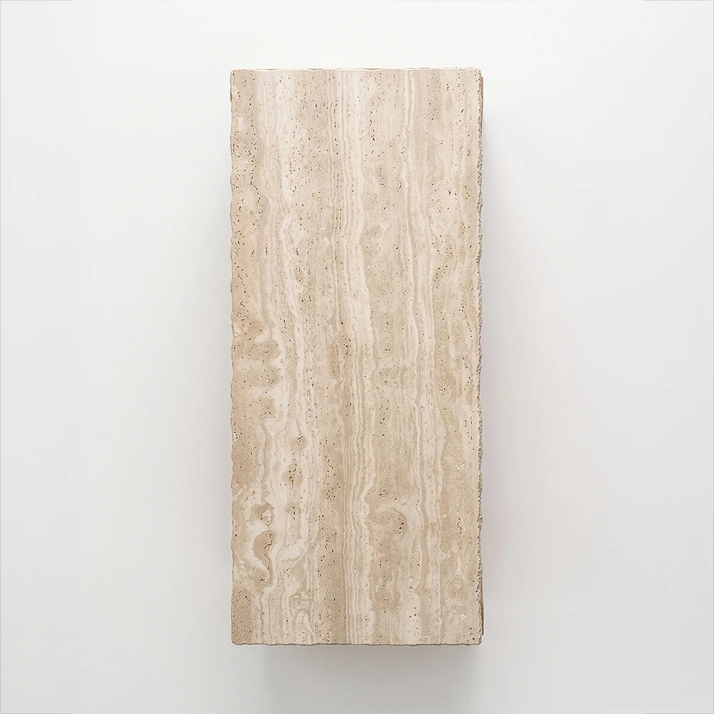 Overhead view of the Santos Desk by Studio Romell, highlighting its rectangular beige stone top with flowing cream veins, small natural cavities and irregular edges.